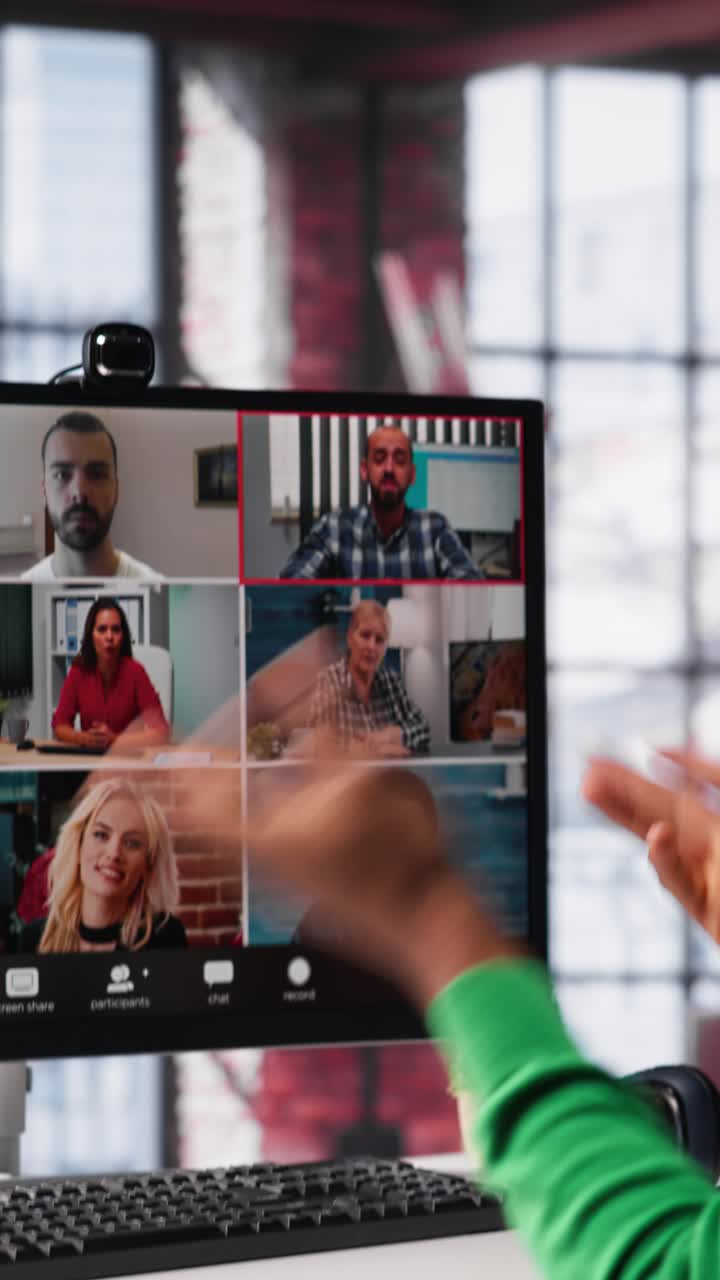 Vertical Video Manager talking to employees during web video call at home
