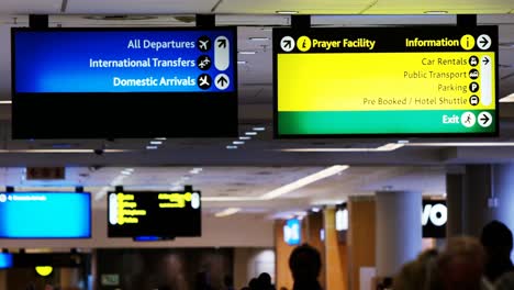 directional signs at airport terminal