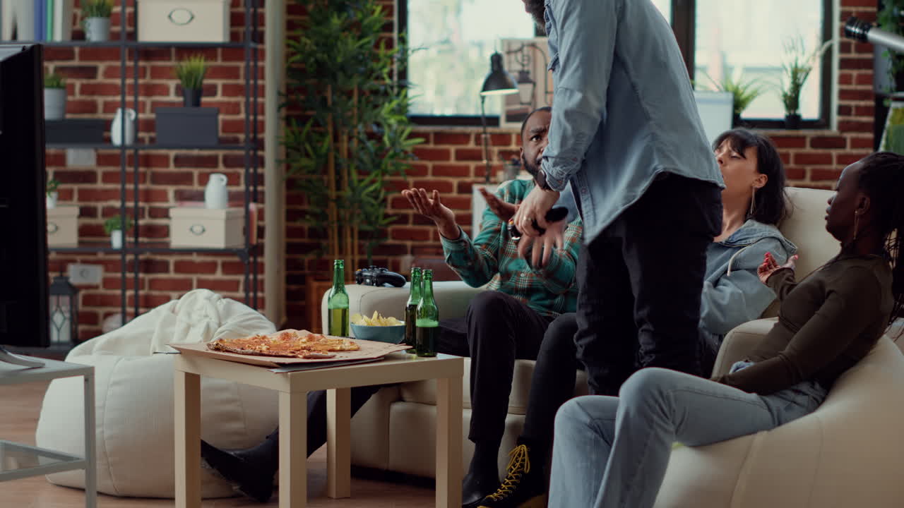 Diverse group of people playing video games with vr headset