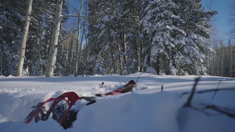 woman falling into the snow in slow motion 60p