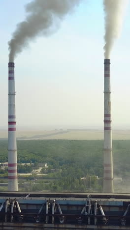 smoking pipes of thermal power plant. smoke from factory chimney in an industrial plant