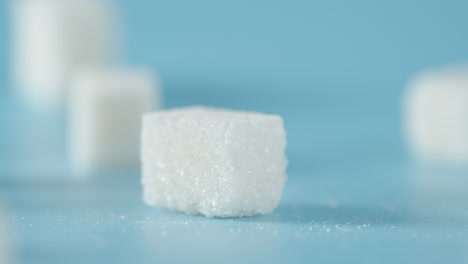 sugar cubes fall on the table.