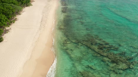 Drone-flying-over-beach-in-Caribbean