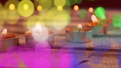 Animation-of-spots-of-light-over-christmas-tea-lights