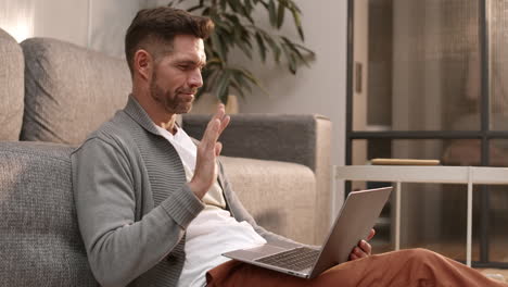 man having video call in apartment