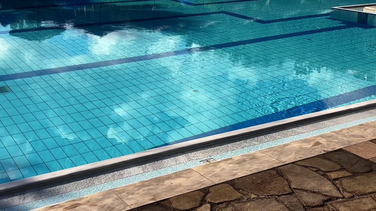 Crystal clear water in a tiled pool corner at Crete, Greece