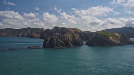 rock formations a the nothern end of south island entering the cook strait. view from the ferry driving through the malborough sound of new zealand, south island