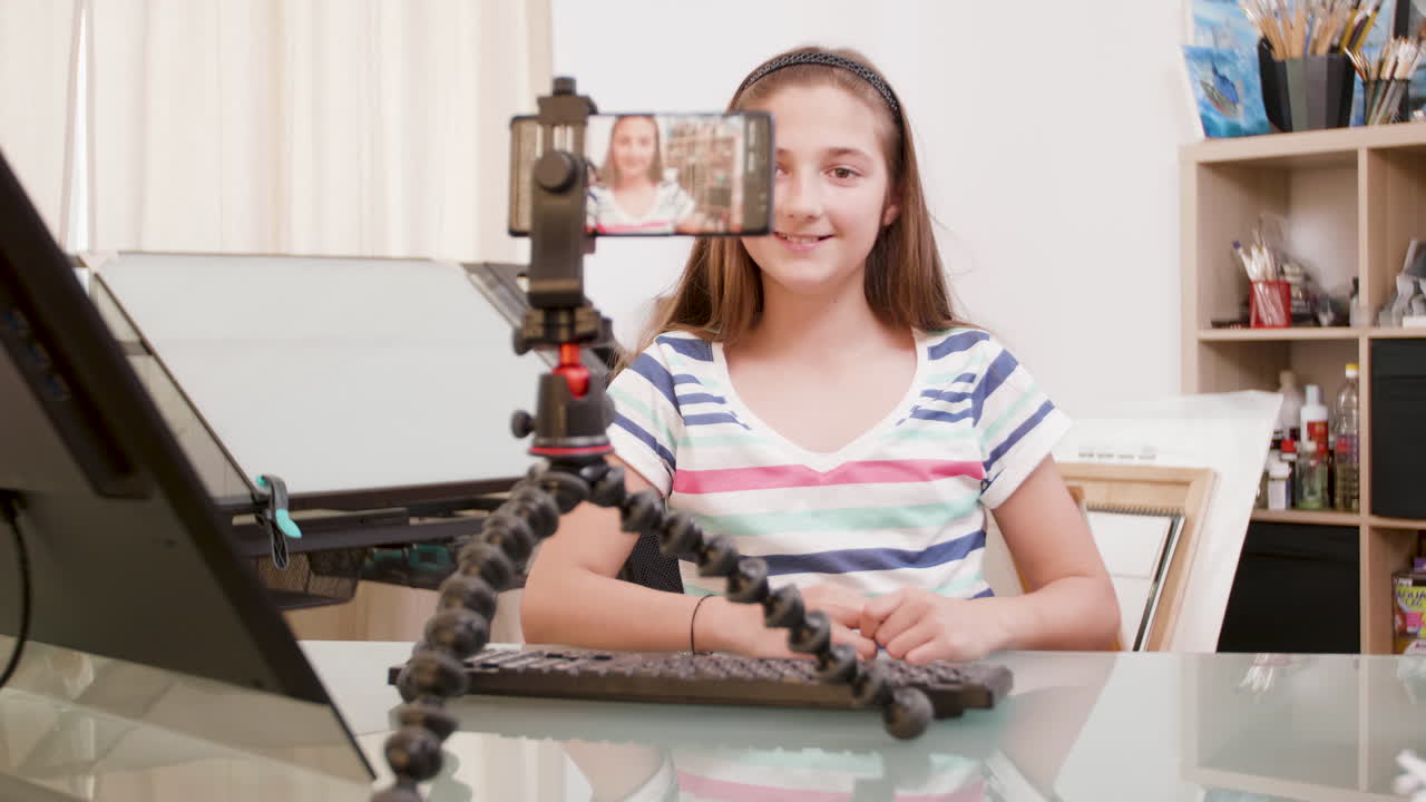 Teen girl vlogging about digital art