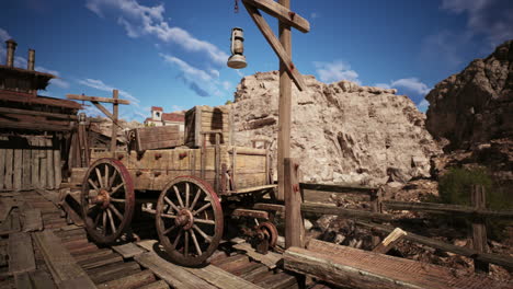 an old wooden wagon on a weathered platform in a rugged canyon landscape