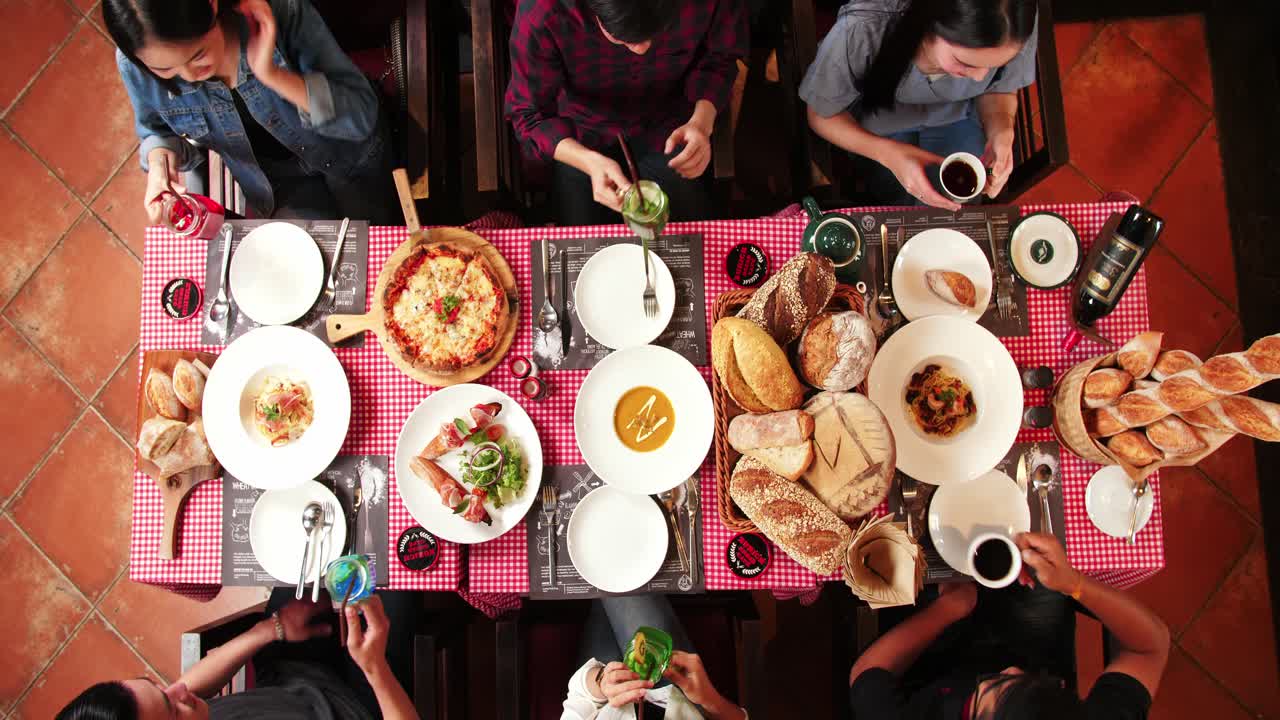 Friends enjoying a meal together at a restaurant