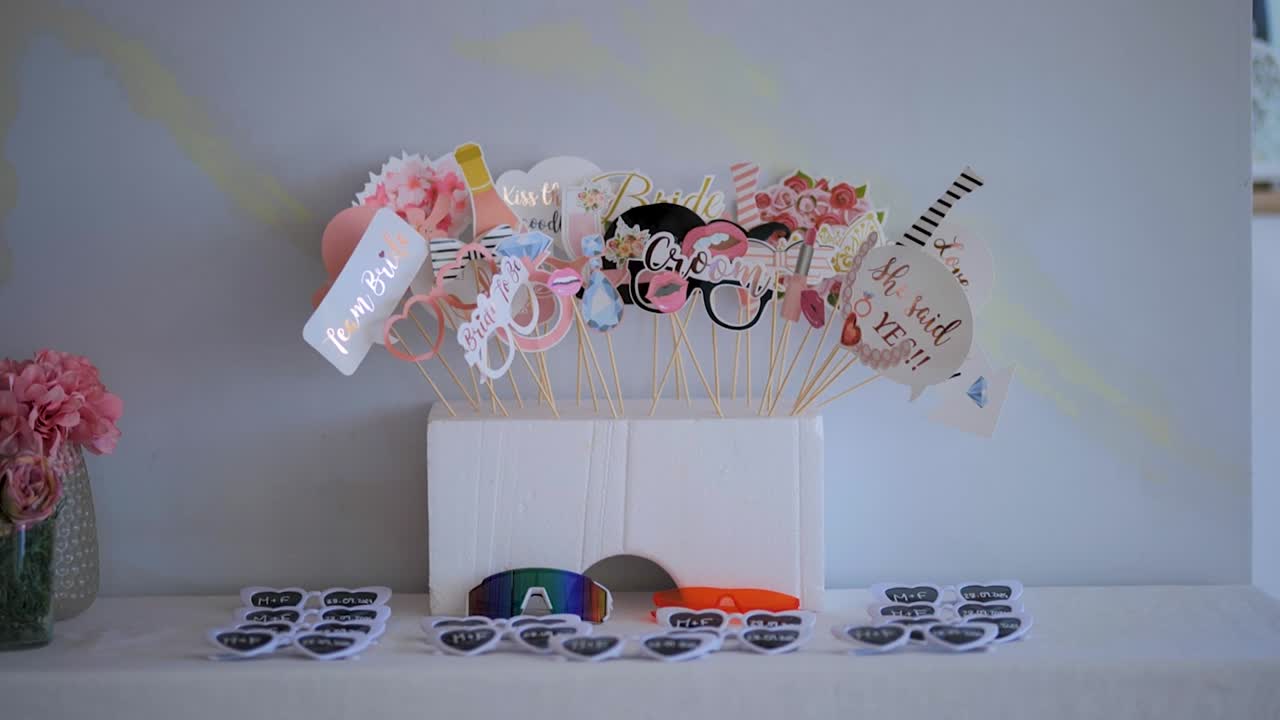 Photography Party Accessories for Guests on a White Table for Wedding or Celebration