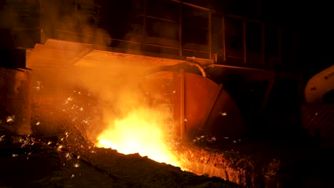 metal smelting process at night