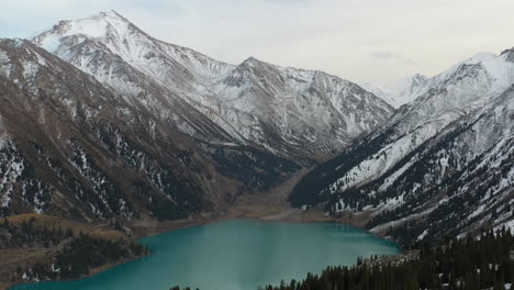 cinematic revealing drone footage of the big almaty lake and the trans-ili alatau mountains in kazakhstan