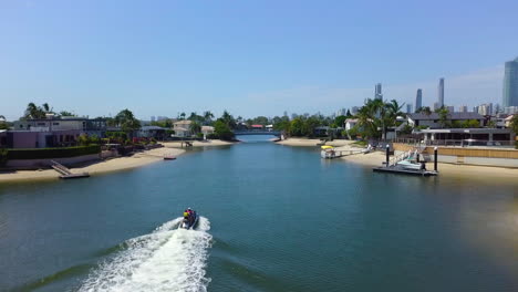 aerial drone tracking jetski in broadbeach waters, gold coast
