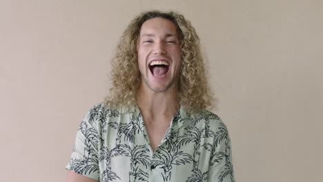 portrait-of-handsome-young-man-laughing-happy-blonde-long-hair