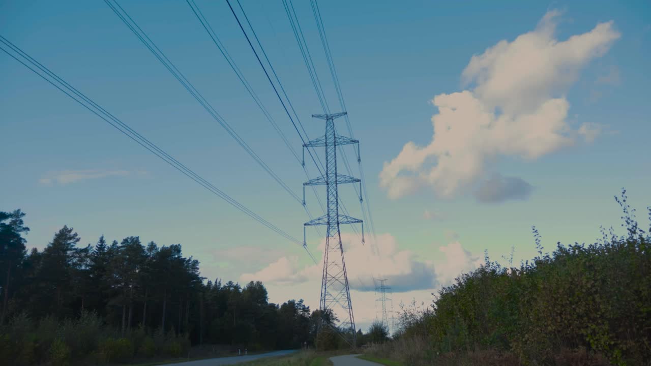 Time lapse or timelapse footage of a blue sky that has white clouds with shadows moving in it