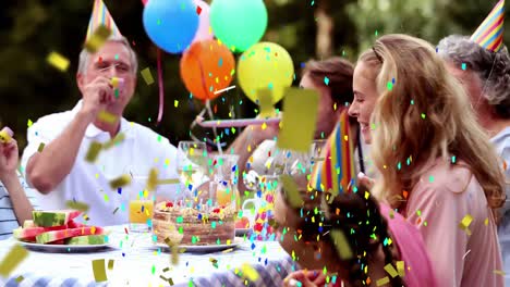 animación de confeti multicolor cayendo sobre la familia en sombreros de fiesta