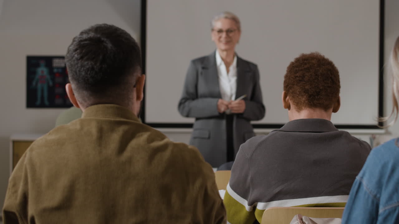 Classroom lecture with a teacher presenting to students