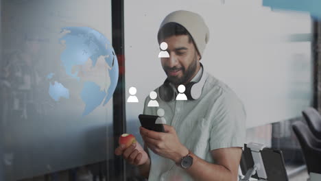 animation of digital icons, globe and data processing over biracial businessman in office