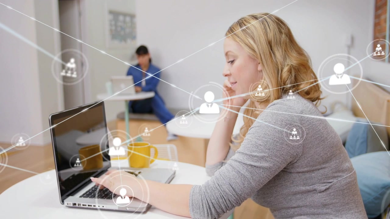 Woman placing hand on laptop, on phone and typing in home, user-icons expanding for tech teamwork