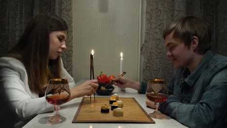 couple enjoying a romantic sushi dinner