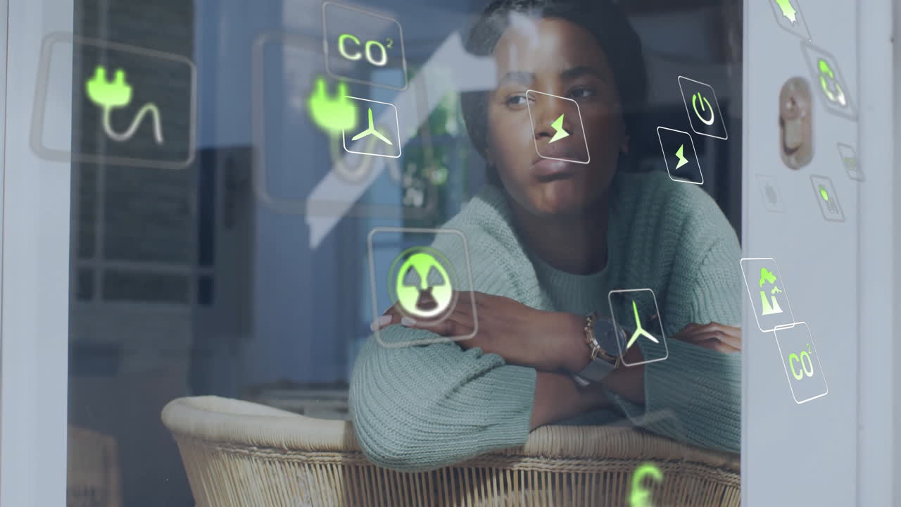 animación de iconos ecológicos sobre mujer afroamericana por la ventana en casa