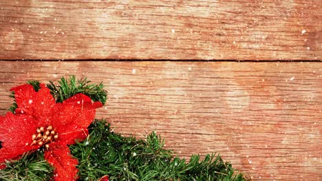 Christmas-decoration-on-wood-combined-with-falling-snow