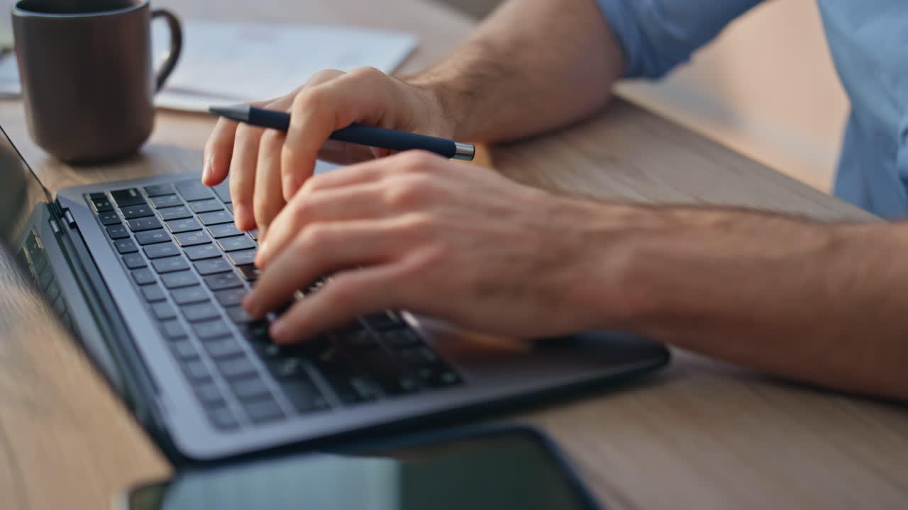 Inspired man thinking solution working computer. Closeup hands typing keyboard