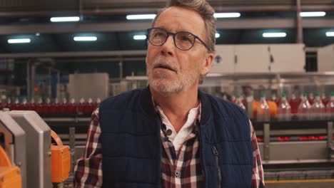 male worker working at bottling plant