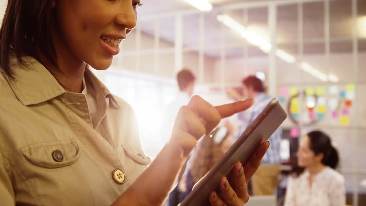 Female business executive using digital tablet