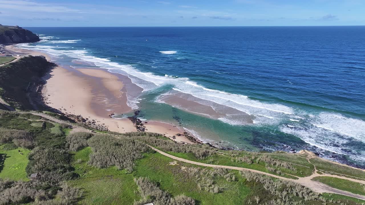 Praia Grande Beach At Sintra In District Of Lisbon Portugal. Beach Skyline. Nature Landscape. Summer Travel. Praia Grande Beach At Sintra In District Of Lisbon Portugal. Tropical Scenery.