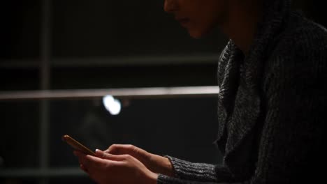 commuters using mobile phone in waiting area 4k