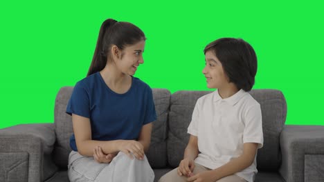 Happy-Indian-cousins-talking-to-each-other-Green-screen