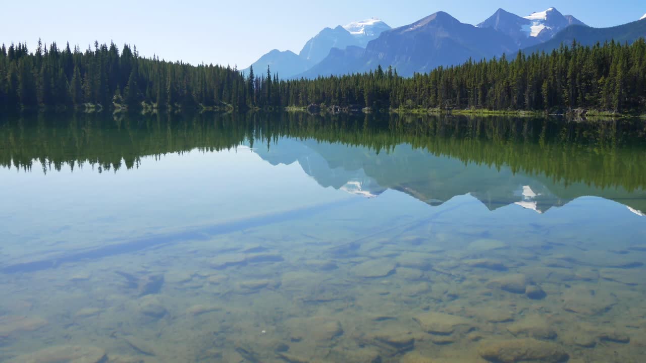 summer clear claim blue lake view with beautiful mountain range and clear blue sky in summer holiday in Herbert lake in banff national park,Alberta,Canada