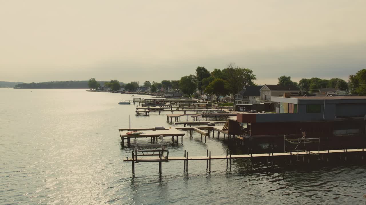 Drone shot of the beach houses and docks and boats for swimming at Sodus point New York vacation spot at the tip of land on the banks of Lake Ontario