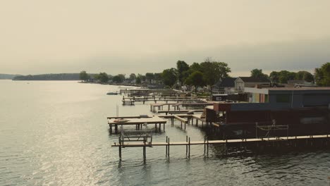 drone shot of the beach houses and docks and boats for swimming at sodus point new york vacation spot at the tip of land on the banks of lake ontario