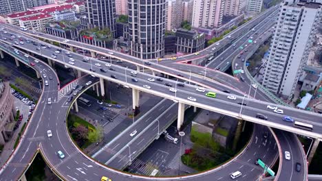 aerial view of highway junctions with roundabout. bridge roads shape circle in structure of architecture and transportation concept. top view. urban city, shanghai downtown, china.