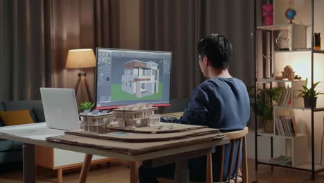 persona que trabaja en un proyecto de diseño de casa 3d por la noche