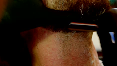 hairdresser using edge razor in hair salon 4k