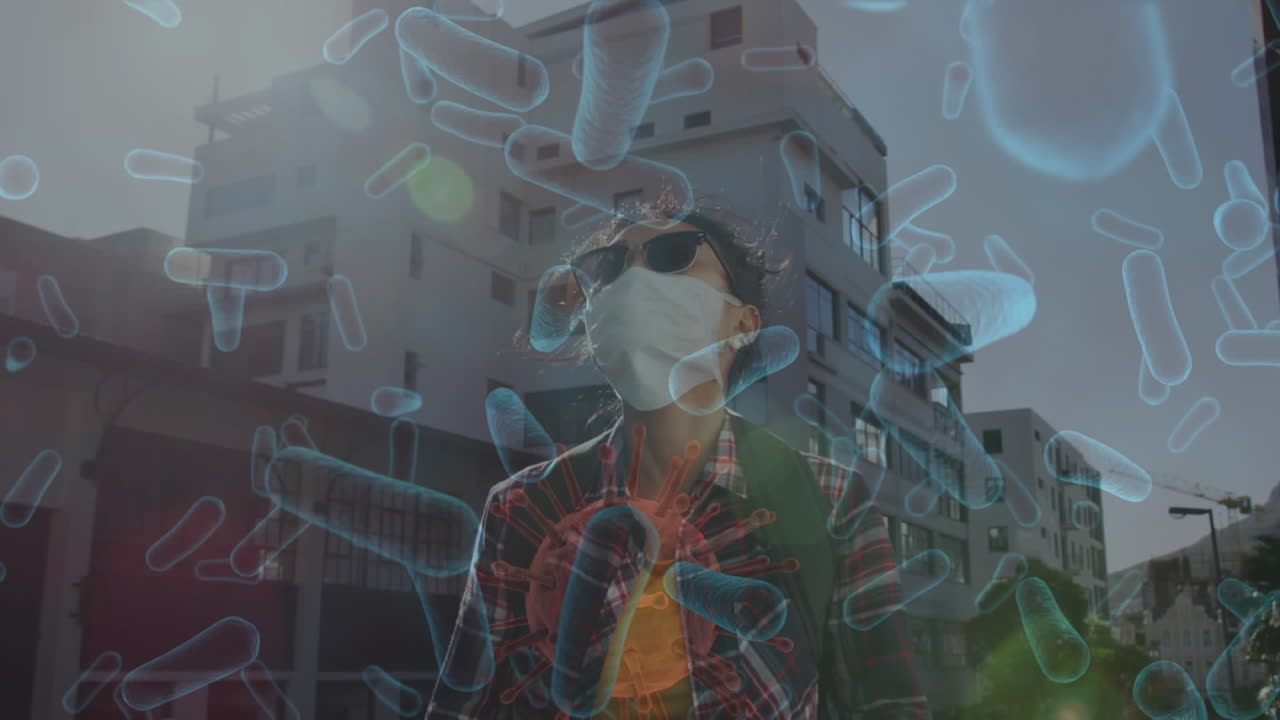 길거리에서 스마트폰을 사용하여 얼굴 마스크를 착용 한 아시아 여성에 대해 떠다니는 여러 혈관