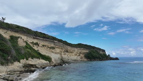 Aerial-view-in-front-of-the-steep-rocky-coast-in-Rio-San-Juan,-Dominican-Republic