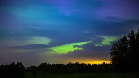 Beautiful-timelapse-view-of-northern-lights,-aurora-on-a-starry-night-over-green-forest