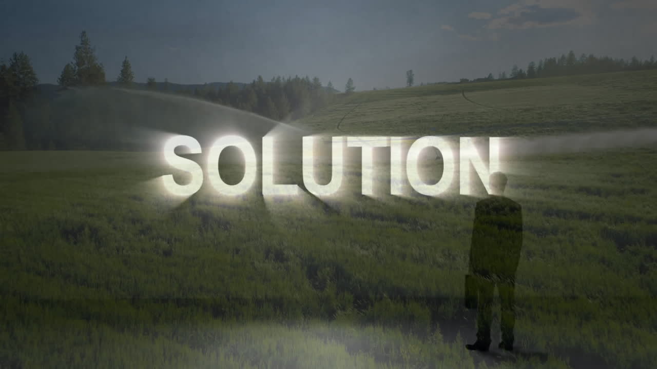 Standing in green field, person with glowing animation of solution text