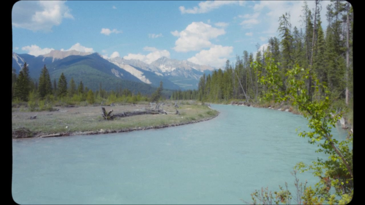 Blue glacier river flowing in summer