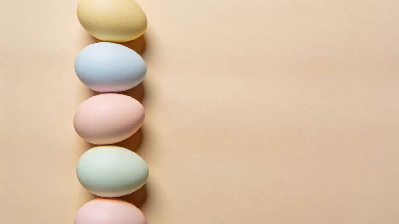 Shifting five pastel eggs rising on left beige surface casting soft shadows after nudge, copy space