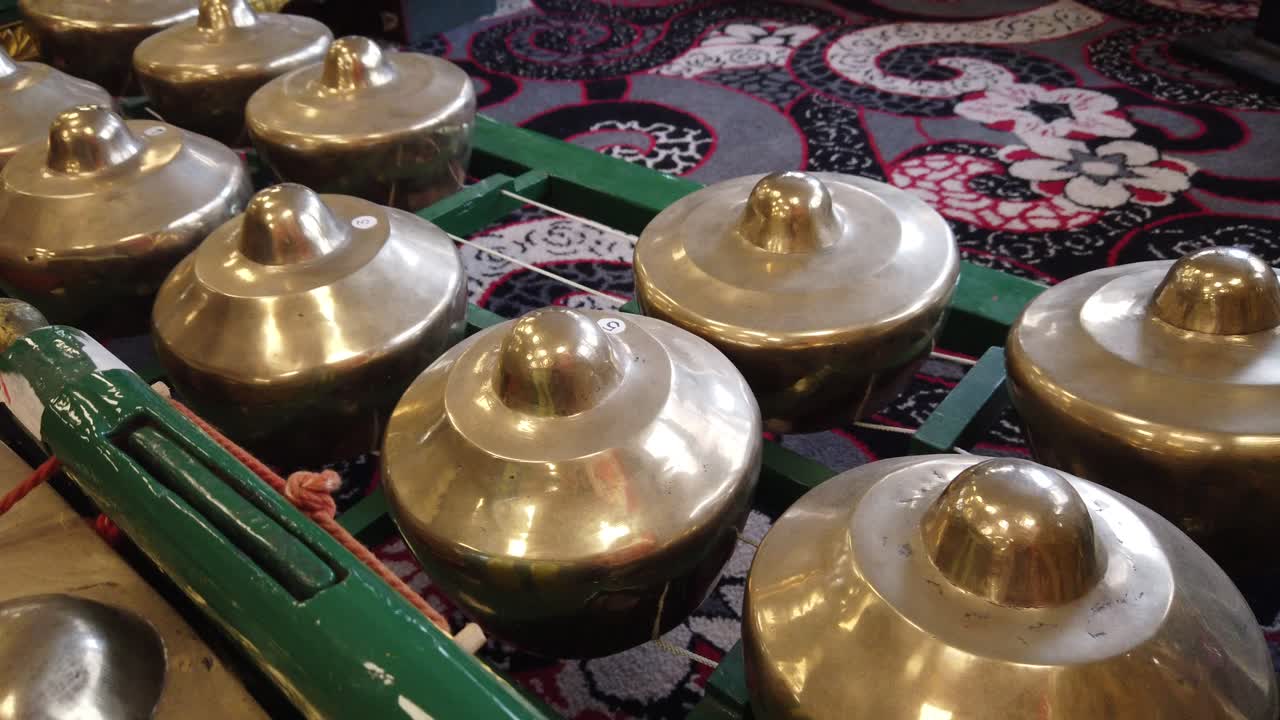 Javanese Gamelan Musical Instruments Bells and Bronze Gongs of Indonesia Closeup