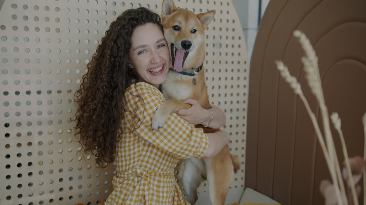 Woman Hugging a Shiba Inu Dog