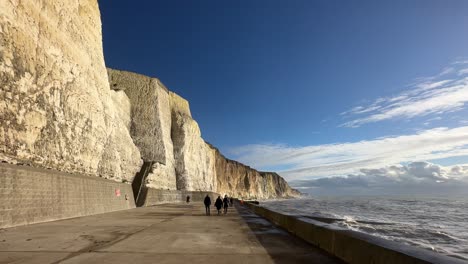 Point-of-view-walking-on-coastal-path-in-East-Sussex-with-cliffs,-UK