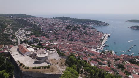 Establishing-shot-of-Hvar-city-and-hilltop-fort