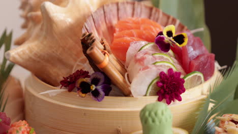 beautifully arranged sashimi basket laid out in a table -panning close up shot